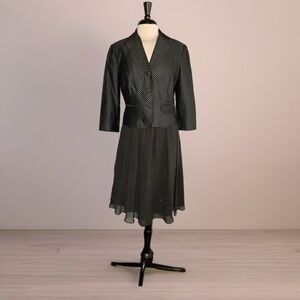 I bought this for my mother’s funeral. Jacket 100% silk - sheer lined skirt. 10